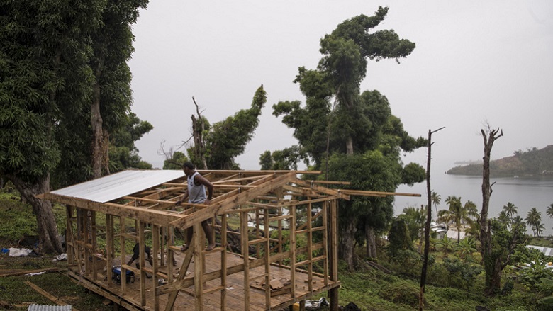 Volunteers work on a new house frame in Namarai, Ra Province, Viti Levu, Fiji.